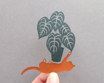 Chat jouant avec un Anthurium Clarinervium en papier découpé, Illustration plantes vertes, cadeau de Noël pour plant lover