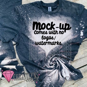 May include: A black t-shirt with a white bleach design. The text "mock-up comes with no logos/watermarks" is printed on the shirt.