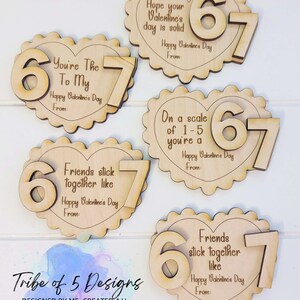 May include: Wooden Valentine's Day heart-shaped cutouts with scalloped edges. Each cutout features the numbers "6" and "7" and a different message, such as "You're The To My" and "Friends stick together like." The words "Happy Valentine's Day" are also included.