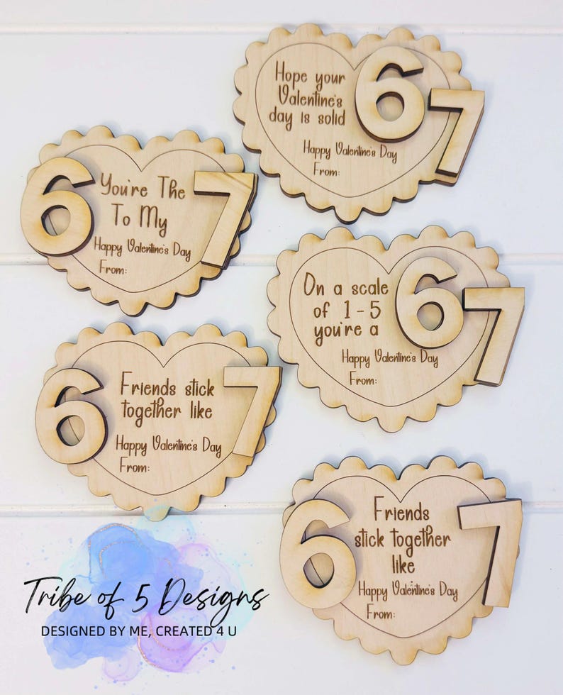 May include: Wooden Valentine's Day heart-shaped cutouts with scalloped edges. Each cutout features the numbers "6" and "7" and a different message, such as "You're The To My" and "Friends stick together like." The words "Happy Valentine's Day" are also included.