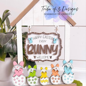 May include: Wooden Easter sign with the text "Happy Easter Every Bunny Welcome" and five colourful bunny figurines in eggshells.