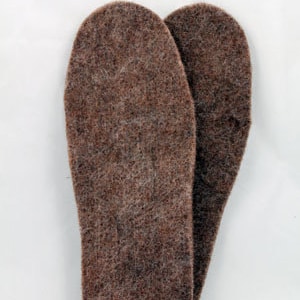 May include: A pair of brown wool insoles for shoes or boots. The insoles are made of a soft, fuzzy material and are designed to provide warmth and comfort.