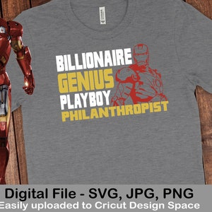 May include: A grey t-shirt featuring a red and yellow graphic of Iron Man. The text "BILLIONAIRE GENIUS PLAYBOY PHILANTHROPIST" is printed in yellow on the shirt.