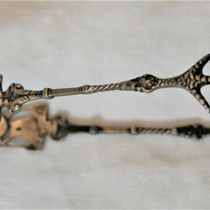 Sugar tongs antique silver
