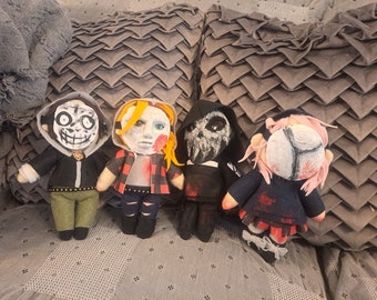 May include: Four handmade plush toys, each with a different mask and bloody details. The toys are made of felt and fabric and are approximately 10 inches tall.