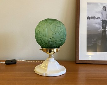 Table lamp with porcelain foot and vintage green art nouveau glass globe lampshade