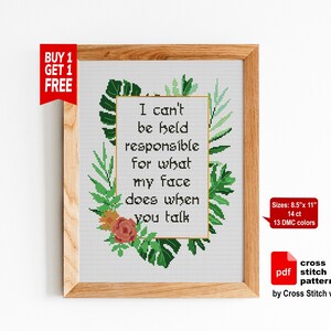 May include: Cross-stitch pattern framed in wood. The design features the text "I can't be held responsible for what my face does when you talk" surrounded by green leaves and flowers. The pattern size is 8.5" x 11".
