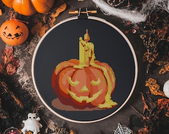 不気味なカボチャのクロスステッチパターン ハロウィンの光るカボチャ