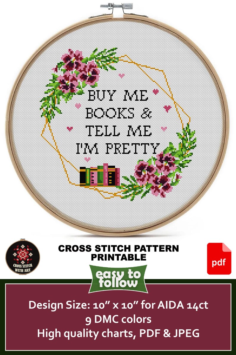 Cross-stitch pattern in a wooden hoop. The design features the text "BUY ME BOOKS & TELL ME I'M PRETTY" surrounded by floral and geometric elements. The design size is 10" x 10".