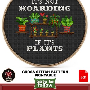 May include: Cross stitch pattern for a hoop art project. The design features a black background with the text "It's not hoarding if it's plants" and a colorful illustration of potted plants on a shelf. The pattern is available in color and black and white charts, in PDF and JPEG formats. The design size is 6 inches by 6 1/2 inches and uses 14 DMC colors.