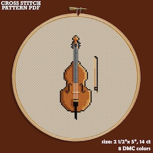 May include: Cross stitch pattern PDF for a brown double bass with a bow. The pattern is 2 1/2 inches by 5 inches and uses 14 count fabric with 8 DMC colors.