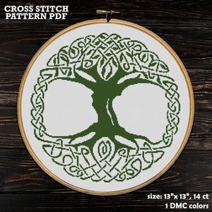 May include: A cross-stitch pattern in a wooden hoop featuring a green Celtic tree design. The text "CROSS STITCH PATTERN PDF" is at the top. The pattern is 13" x 13" and uses 1 DMC color.