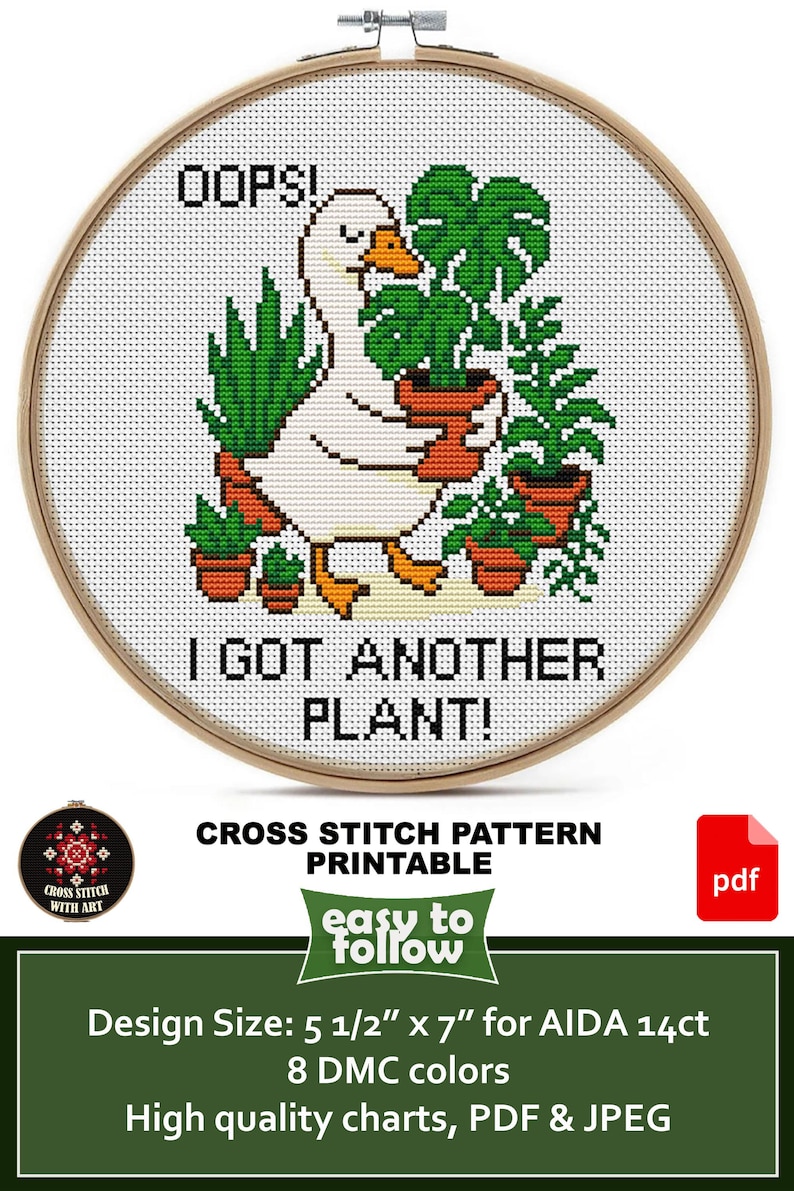 May include: Cross-stitch pattern featuring a white goose with orange beak and feet, holding potted plants. Text reads "OOPS! I GOT ANOTHER PLANT!" in black. The design is in a wooden embroidery hoop.