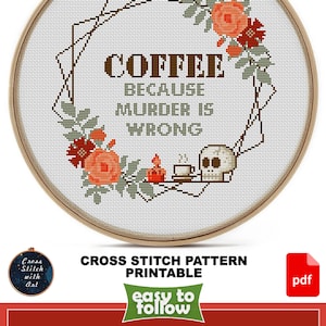 May include: Cross stitch pattern printable for a coffee themed design with the text "Coffee because murder is wrong". The design features a skull, a coffee cup, and a floral wreath. The pattern is 9 inches by 9 inches and uses 11 DMC colors.