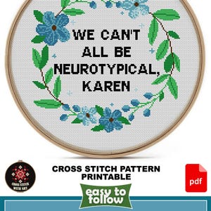 May include: Cross-stitch pattern in a wooden hoop with the text "WE CAN'T ALL BE NEUROTYPICAL, KAREN" surrounded by blue flowers and green leaves. The design size is 25.4 cm x 25.4 cm. Includes PDF and JPEG files.