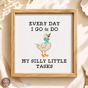 Silly goose, Funny cross stitch pattern PDF shown in a wooden frame with the quote "Every Day I Go & Do My Silly Little Tasks" and complete design information.