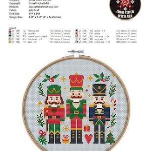 May include: Cross-stitch pattern featuring three toy nutcrackers in red, green, and blue uniforms, surrounded by festive holiday elements. The design area is 6.50" x 6.00" (16.51 cm x 15.24 cm). The text "Nutcrackers" is at the top.