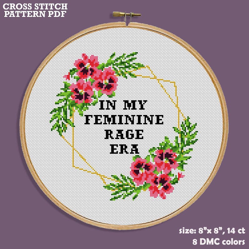 Cross stitch pattern PDF for an 8 inch by 8 inch hoop with a floral design and the text "In My Feminine Rage Era".