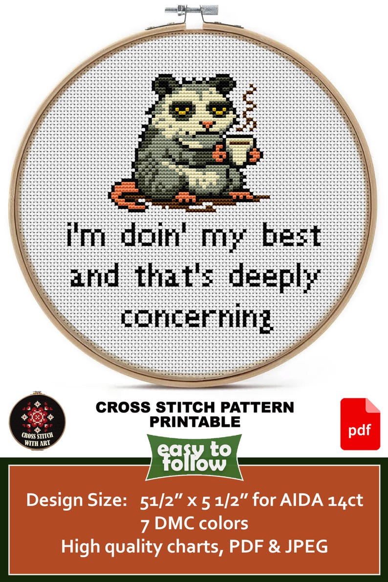 May include: Cross-stitch pattern featuring a possum holding a mug, stitched on white fabric within a wooden hoop. The text reads "I'm doin' my best and that's deeply concerning." The design size is 5 1/2" x 5 1/2".