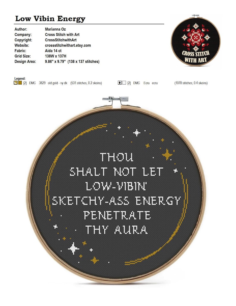 May include: A circular wooden embroidery hoop containing black fabric with white cross-stitched text that reads: THOU SHALT NOT LET LOW-VIBIN' SKETCHY-ASS ENERGY PENETRATE THY AURA. The design includes a curved gold line and small white and gold stars.