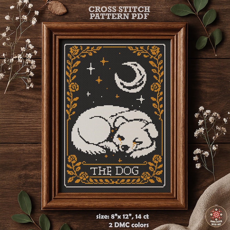 May include: A framed cross-stitch pattern featuring a sleeping white dog against a black background with a crescent moon and stars. The text "THE DOG" is below the dog. The frame is brown. The pattern size is 8" x 12".