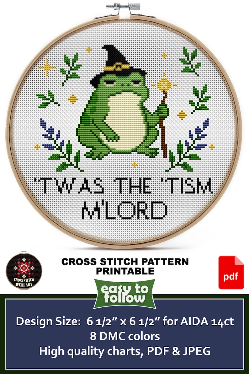 May include: Cross-stitch pattern featuring a green frog wearing a witch hat and holding a staff, with the text "'TWAS THE 'TISM M'LORD". The design is 6.5 x 6.5 inches and includes 8 DMC colors. The pattern is printable.