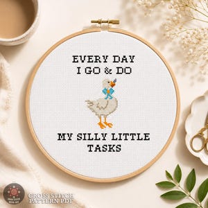 Funny goose cross stitch pattern PDF shown in a wooden hoop with the quote "Every Day I Go & Do My Silly Little Tasks" and complete design information.