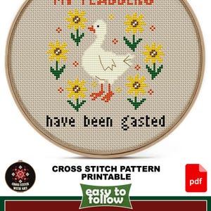 May include: Cross-stitch pattern in a wooden hoop featuring a white goose with orange feet and a beak, surrounded by yellow sunflowers. The text "MY FLABBERS have been gasted" is stitched in orange and black. Design size is 4.5" x 5.5".