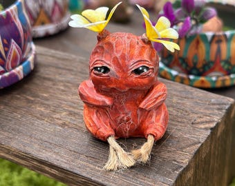 Baby Mandrake, sienna color with yellow pigtails
