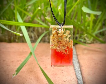 Unique pendant in resin, pigments and gold leaf
