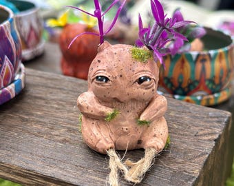 Beige Mandragore baby with purple pigtails