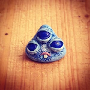 Mini blue monster sculpture with 3 eyes
