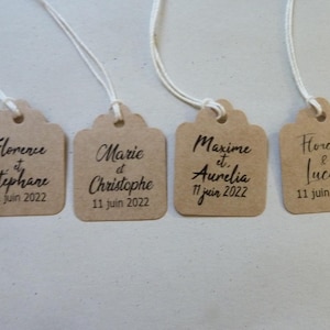 set of 20 personalized square labels printed on kraft and string with first names and wedding date.