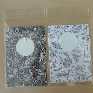 22 sachets cellophane transparent, papier motifs noir et blanc, 2 modèles, cadeau invité, cartes, photo souvenir