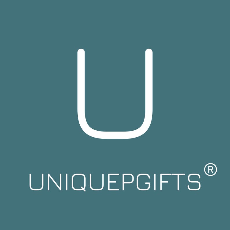 May include: A teal square logo featuring a large white letter U centred at the top. Below the letter, the text UNIQUEPGIFTS is written in a clean white sans-serif font, accompanied by a small registered trademark symbol at the top right corner.