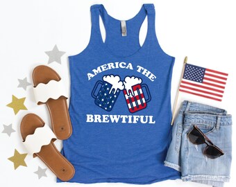 May include: A blue tank top with the text "America the Brewtiful" in white letters. The text is above a graphic of two beer mugs with the American flag design.