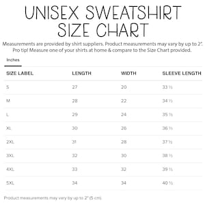 May include: A white size chart for unisex sweatshirts, with measurements in inches. The chart includes sizes S to 5XL, with length, width, and sleeve length dimensions. The text "UNISEX SWEATSHIRT SIZE CHART" is at the top.