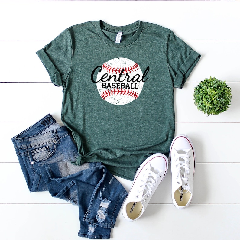 May include: A green t-shirt with a distressed white baseball graphic and the text "Central Baseball" in black.