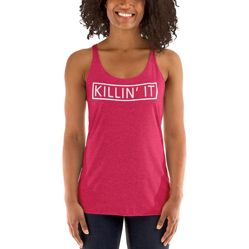 May include: A red racerback tank top with the words "KILLIN' IT" in a white rectangle on the front.