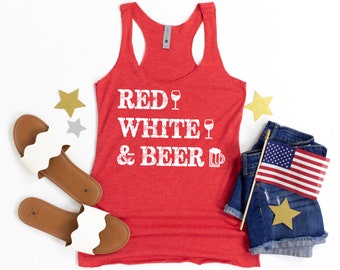 May include: Red, white, and beer tank top with a distressed white graphic. The tank top is red and has a scoop neck. The graphic includes a wine glass and a beer mug.