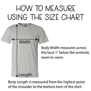 May include: Diagram showing how to measure the width and length of a t-shirt. The width is measured across the bust 1 inch below the armhole, seam to seam. The length is measured from the highest point of the shoulder to the bottom hem of the shirt.