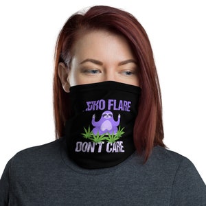 May include: Black face mask with a purple sloth meditating on green marijuana leaves. The text "Slo  Flare Don't Care" is printed on the mask.