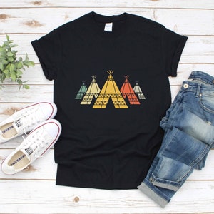 May include: Black t-shirt with a graphic of four colorful teepees. The teepees are in a row and have a retro design.