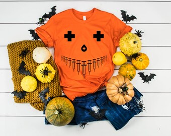 Funny Pumpkin Nurse Costume Halloween Shirt, Nursing Student Syringe Pumpkin Face T-Shirt