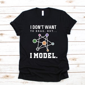 May include: Black t-shirt with white text that reads "I don't want to brag, but... I model."  A stylized molecule graphic is above the text.