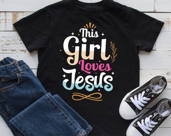 This Girl Loves Jesus T-Shirt, Hoodie, Womens Shirt, Tees, Long Sleeve, Tank Top, Sweatshirt, Kids Tee, Kids Hoodie, Toddler Shirt