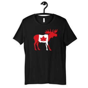 May include: Black t-shirt with a white moose silhouette. The moose is outlined with the Canadian flag, featuring a red maple leaf on a white background.