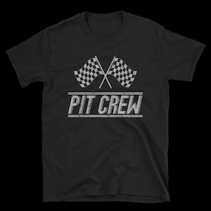 May include: Black t-shirt with a white checkered racing flag design and the text "PIT CREW" in a distressed white font.