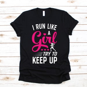 May include: Black t-shirt with white text that reads "I run like a girl try to keep up". The word "girl" is in pink.