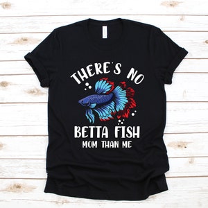 May include: Black t-shirt with a white graphic of a betta fish and the text "There's no betta fish mom than me."